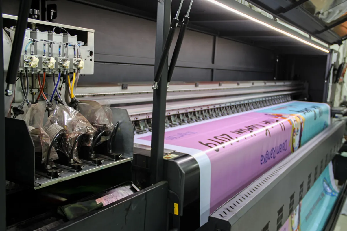 Large-format print production equipment producing branded material